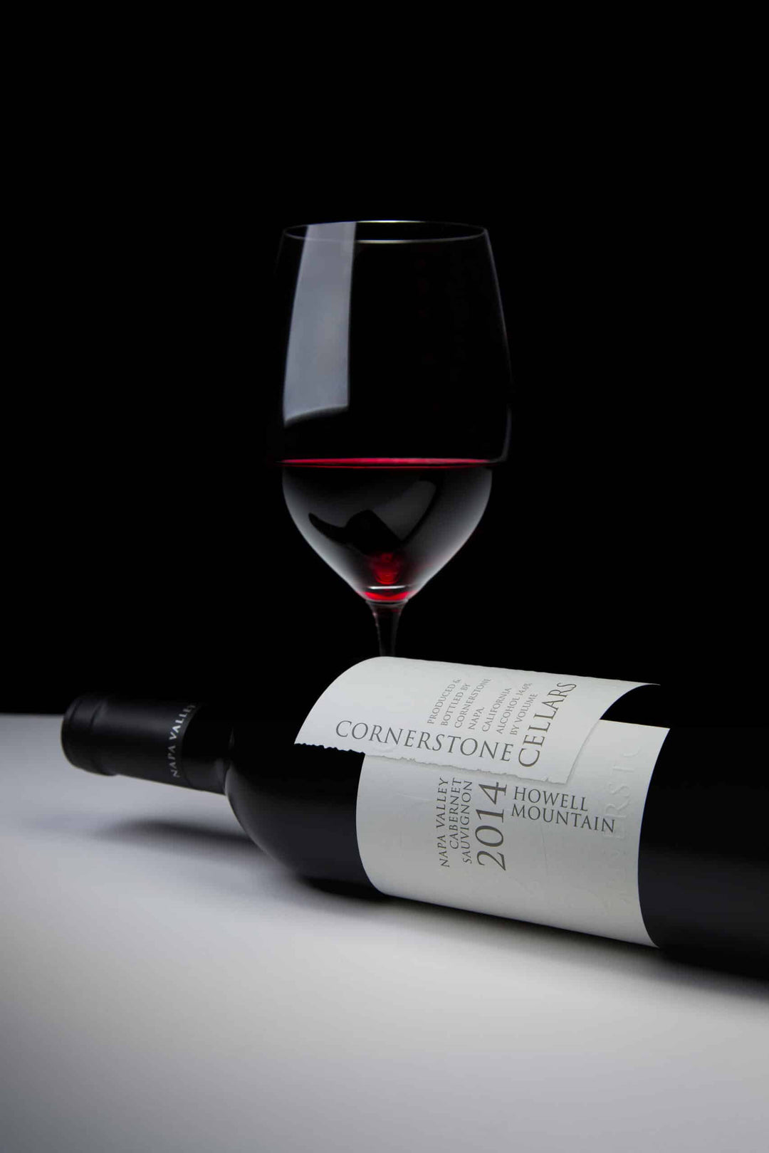 Glass of Napa Valley cabernet sauvignon wine and bottle